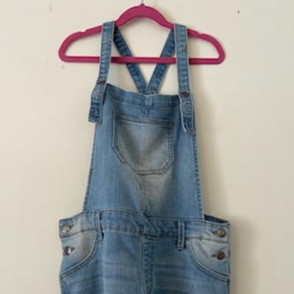 Cute overalls with lace on the ends.